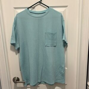 Raised ribbed knit top with pocket, Size medium 
Bought from Discount Diva